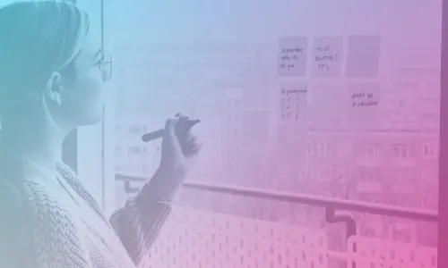 Woman writing on post it notes