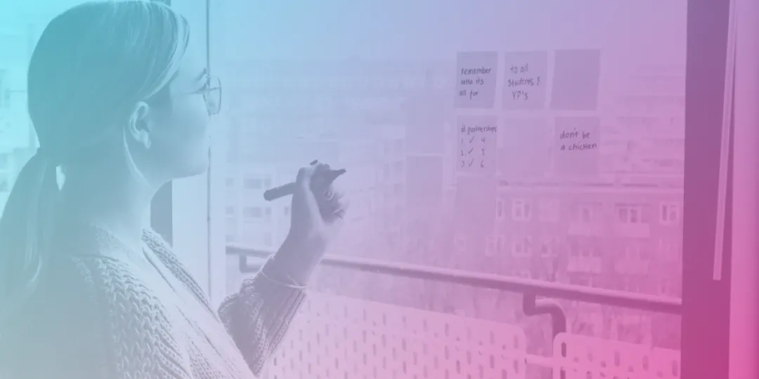 Woman writing on post it notes