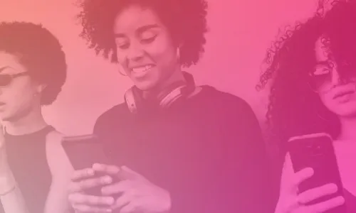 Image of three people looking down at their phones